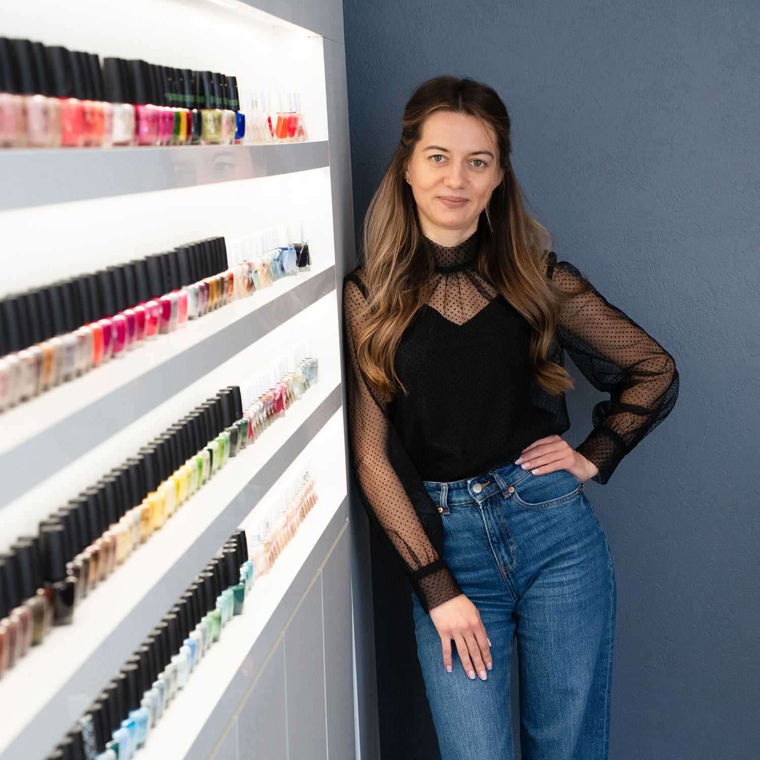 Portrait of Tamila, a professional stylist at Above All Grand Salon and Spa, showcasing their expertise and style.