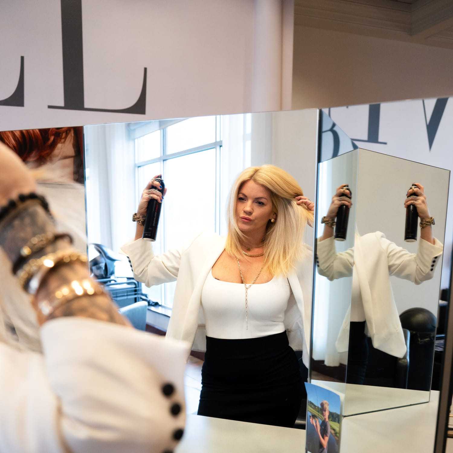 Portrait of Anne, a professional stylist at Above All Grand Salon & Spa, showcasing their expertise and style.