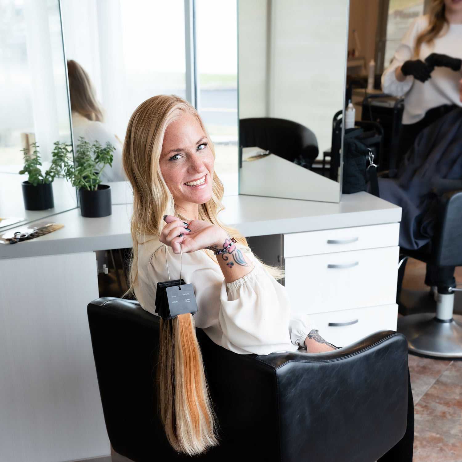 Portrait of Stephanie, a professional stylist at Above All Grand Salon and Spa, showcasing their expertise and style.