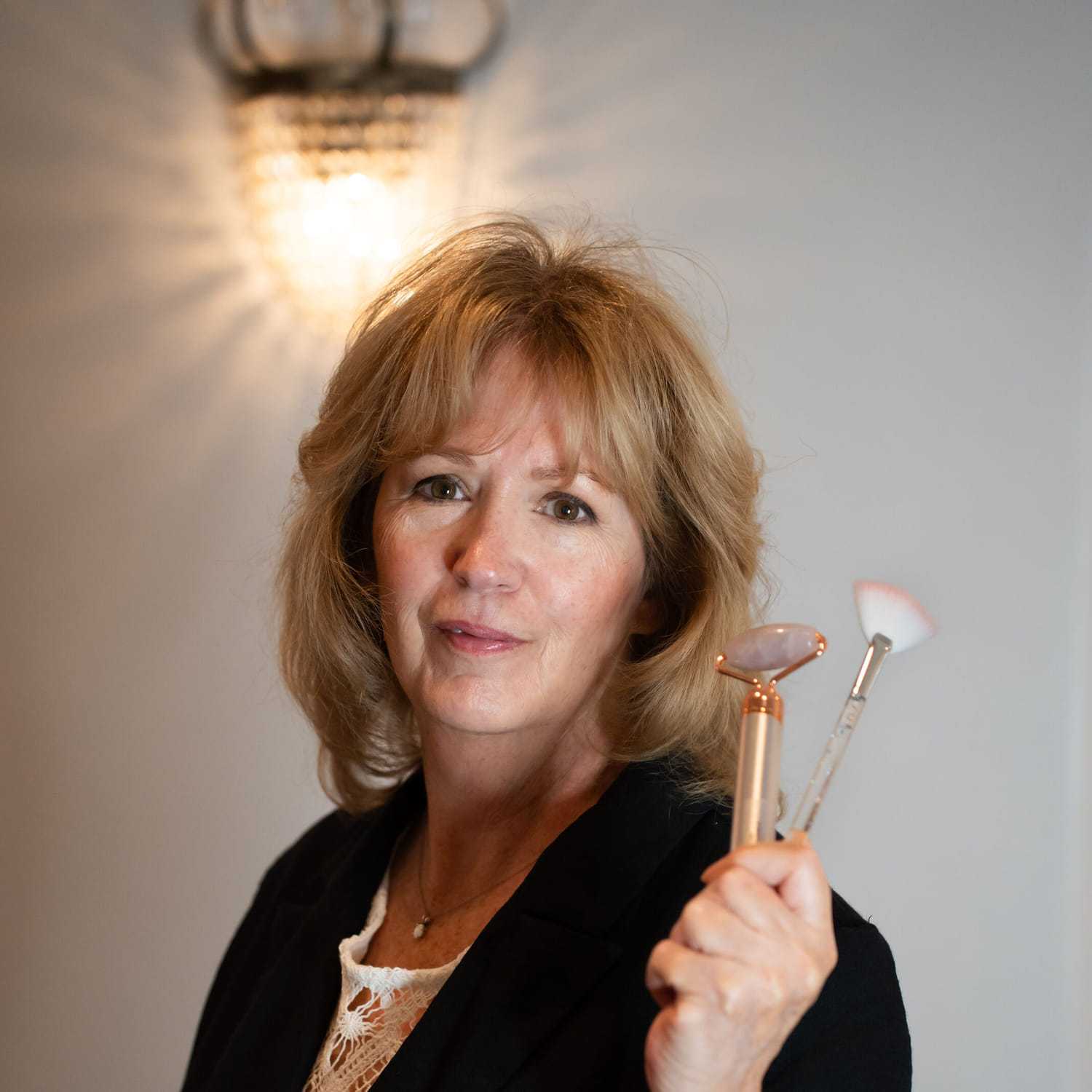 Portrait of Janine, a professional stylist at Above All Grand Salon & Spa, showcasing their expertise and style.