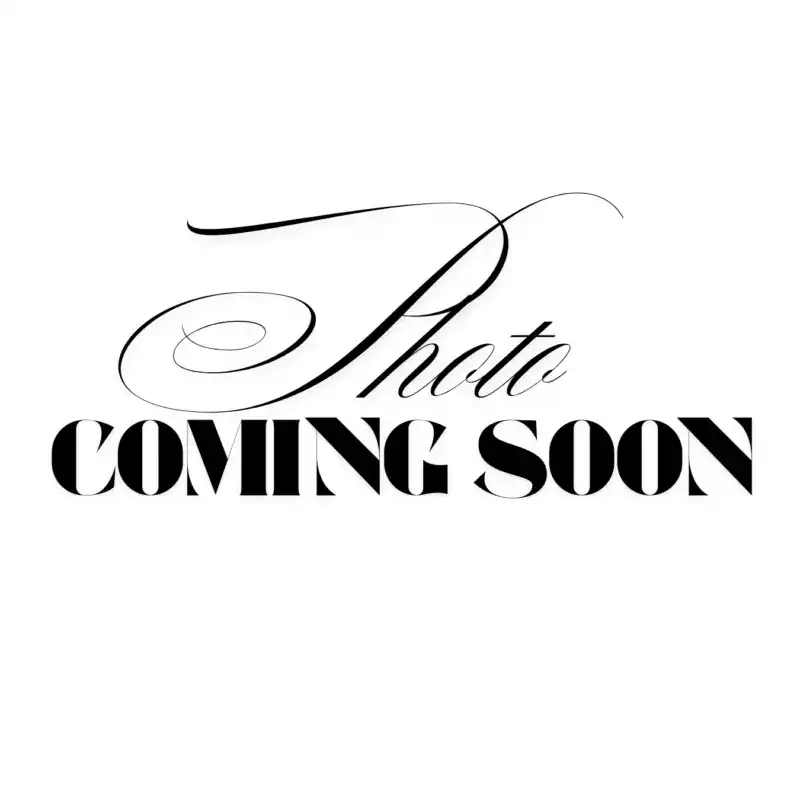 Portrait of Jacki, a professional stylist at Above All Grand Salon & Spa, showcasing their expertise and style.