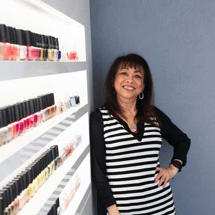 Portrait of Supinya, a professional stylist at Above All Grand Salon and Spa, showcasing their expertise and style.