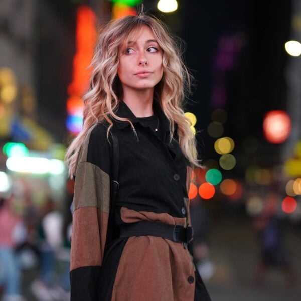 Portrait of Caroline, a professional stylist at Above All Grand Salon and Spa, showcasing their expertise and style.